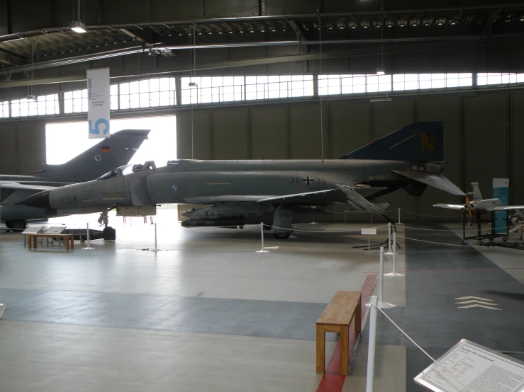 several jets on display in the hangar on display