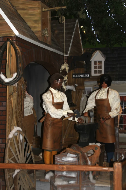 a group of people in brown aprons holding pots with soing in them