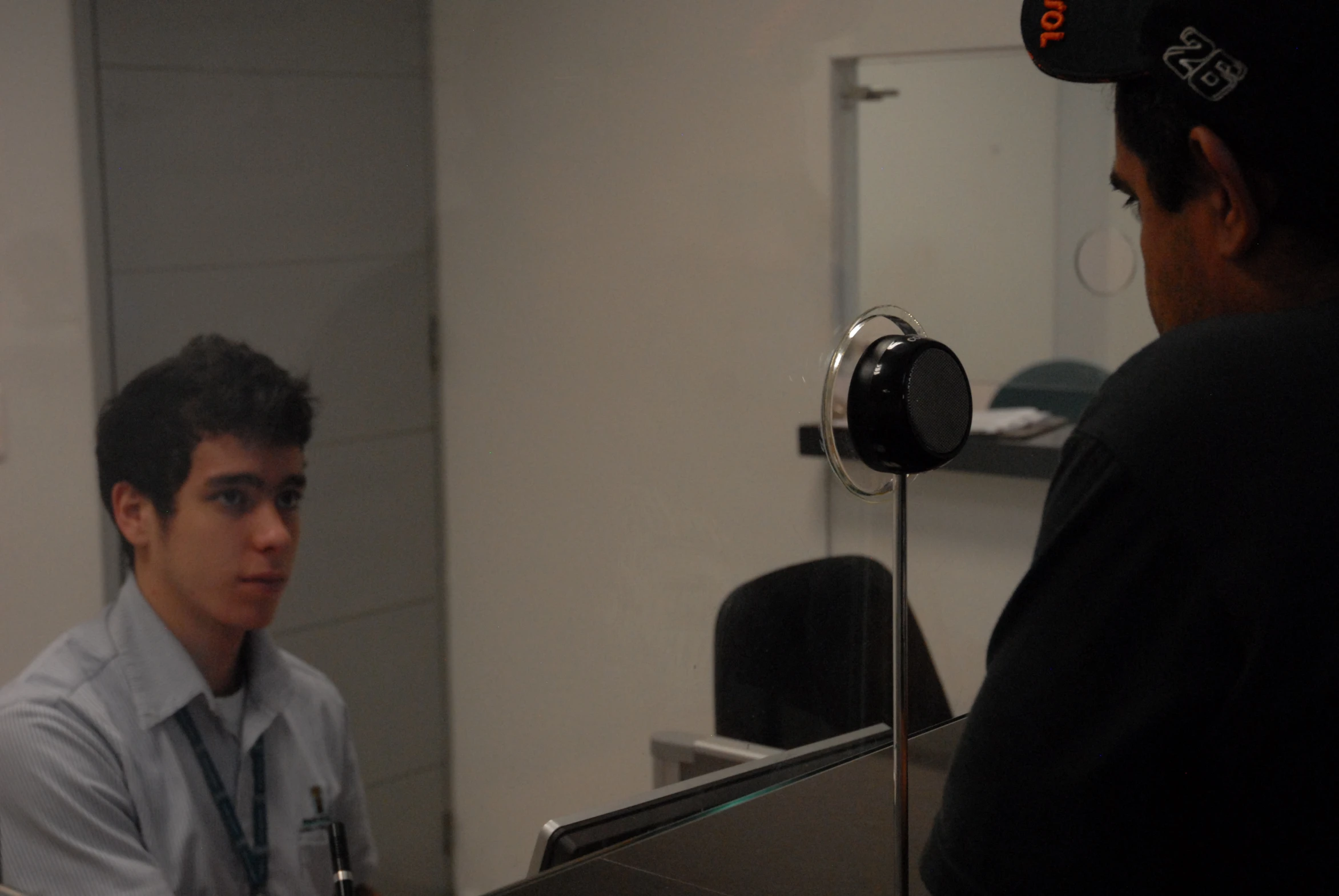 a young man is looking at his reflection in the mirror