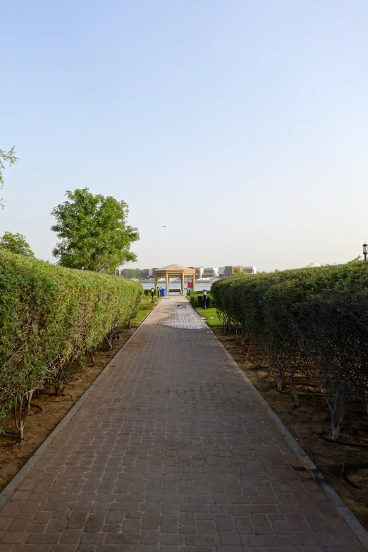 the paved road leads into the parking lot