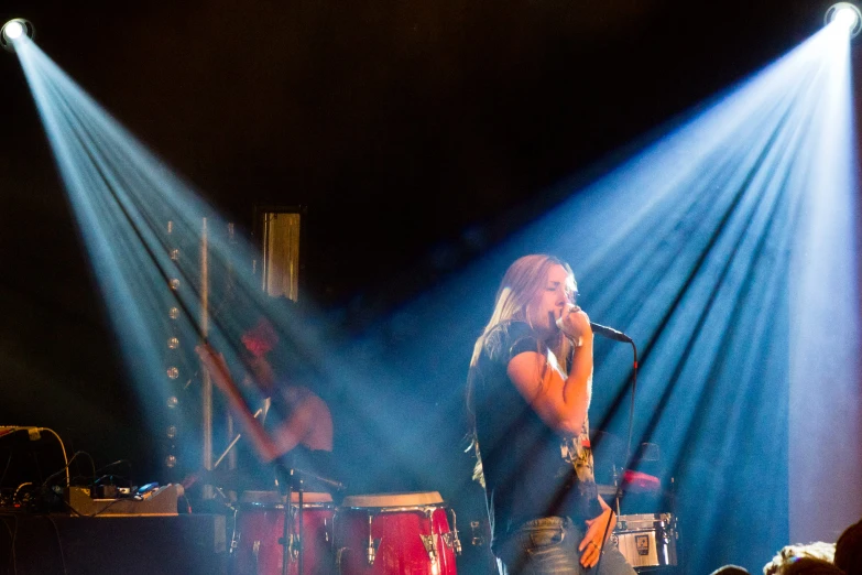 a band plays on stage with their lights off