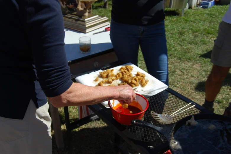 a person holding onto a plate of food