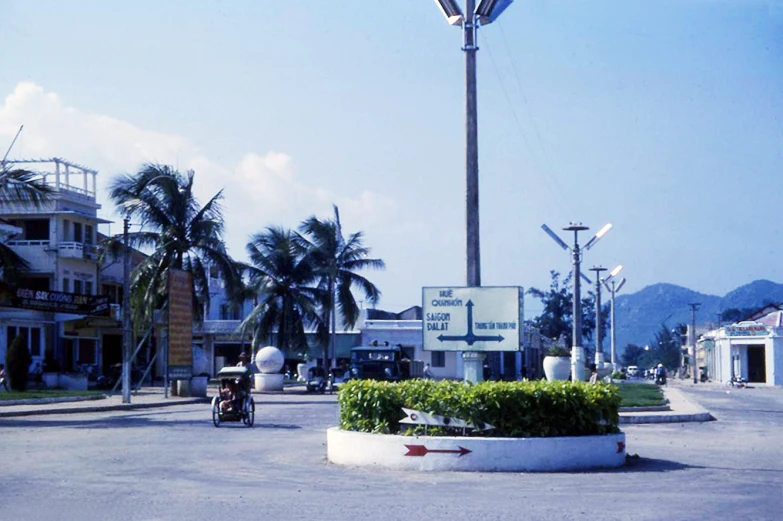 a street light with street lamp posts in the middle of it