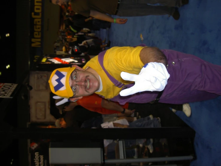 a guy in a sponge bob costume playing with his hands