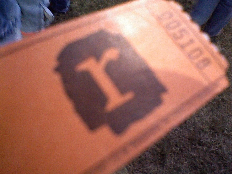 a orange street sign that is on the ground