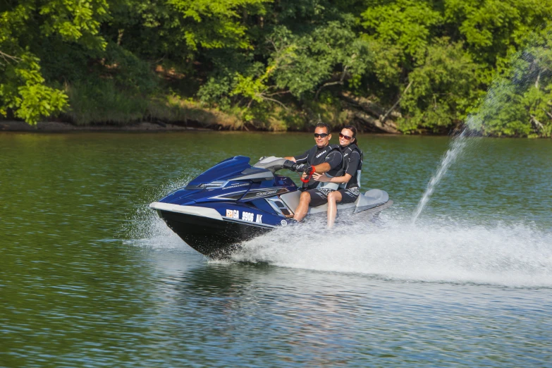 a couple enjoying water ski ride with one of the two people