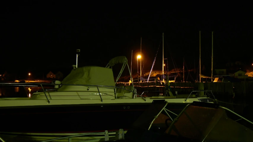 a large boat parked at the dock during the night