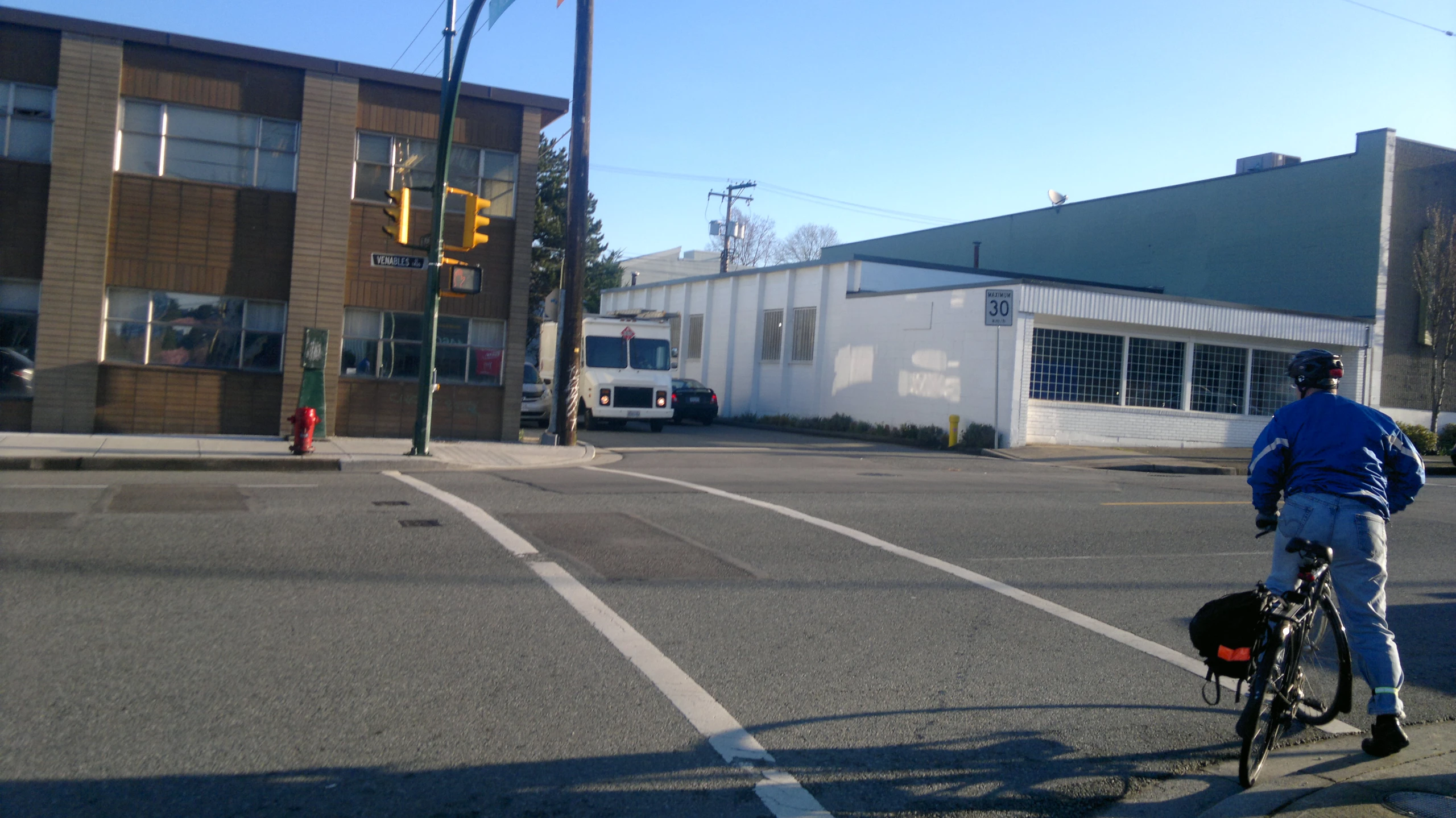 a man riding a bike across a street