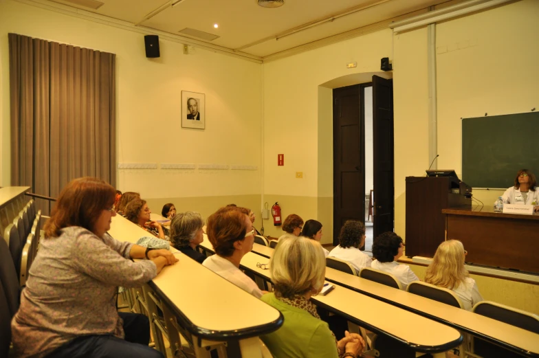 the teacher is giving a lecture to the class