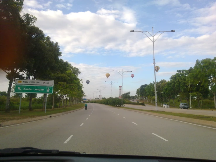 an intersection with one person and another car