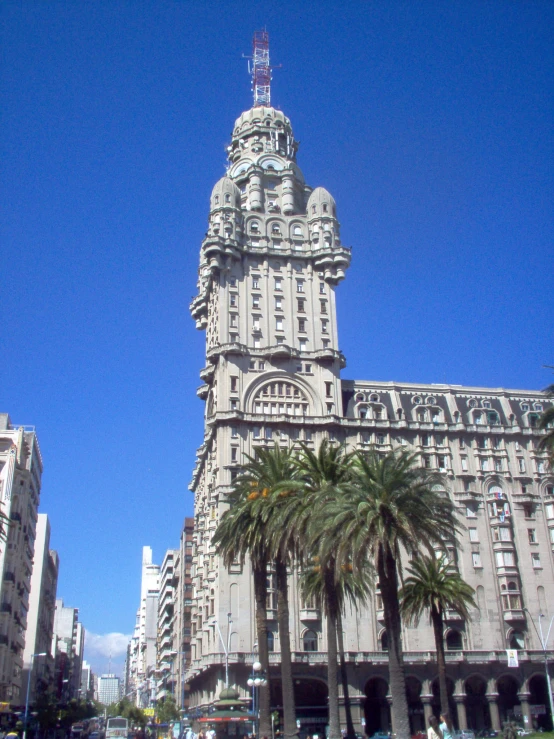 a picture of an old clock tower next to some other buildings