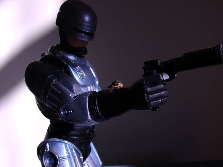 a man in metal armor holding a machine gun