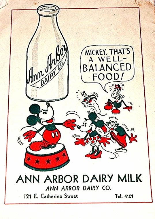 a sign with an ad for an arbor dairy milk advertit