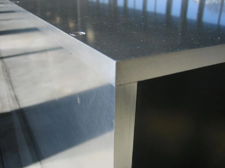 an aluminum desk that is sitting outside