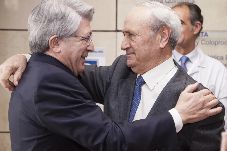 two men emcing while in formal wear