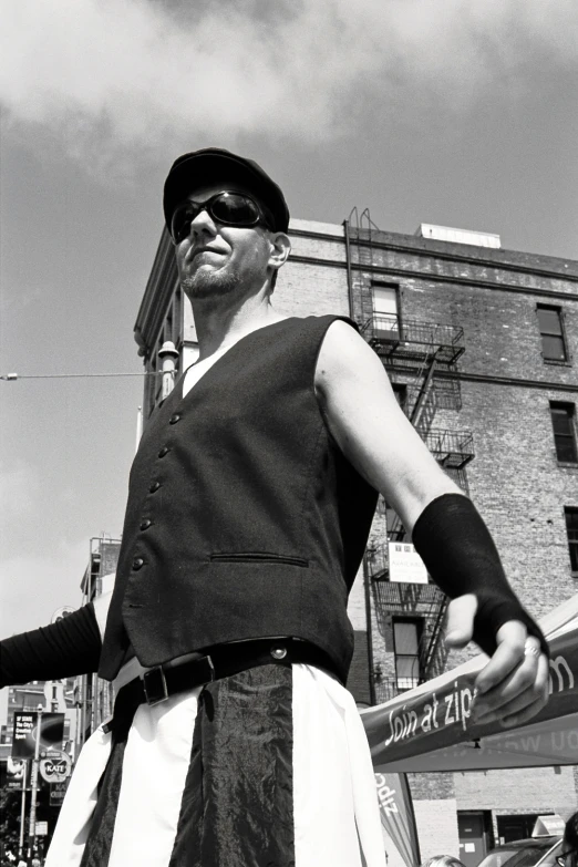 man dressed in an old fashioned clothing posing for a picture