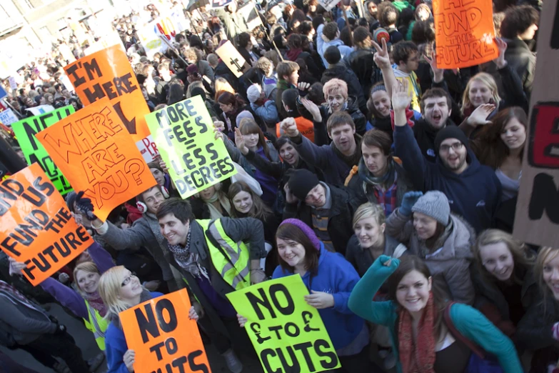 large group of people with signs holding up signs