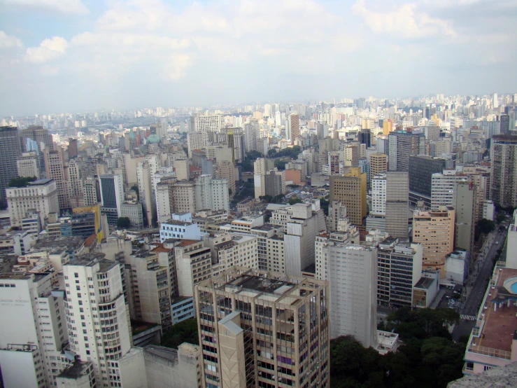 some very big buildings in a city with tall buildings