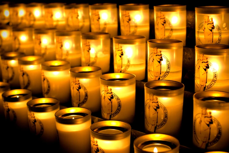 lit candles on display, with chinese writing
