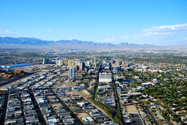 a city area with mountains in the distance