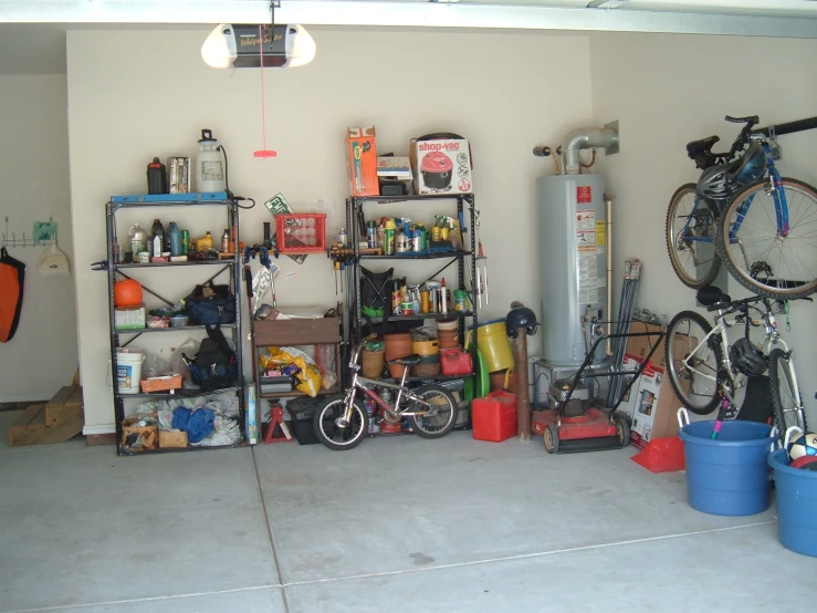 a bicycle is in the middle of a garage filled with equipment