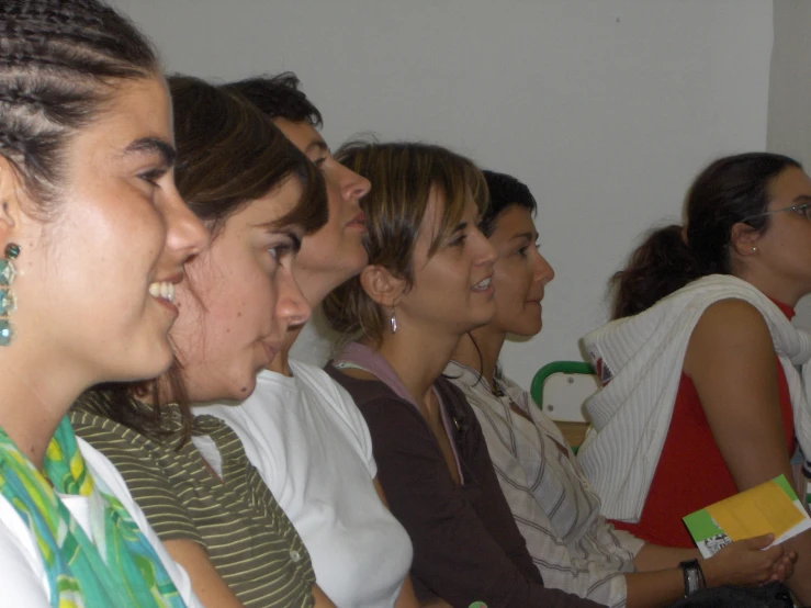 women in the audience listening to a show