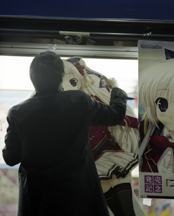 an anime figure is being held over by a puppet man