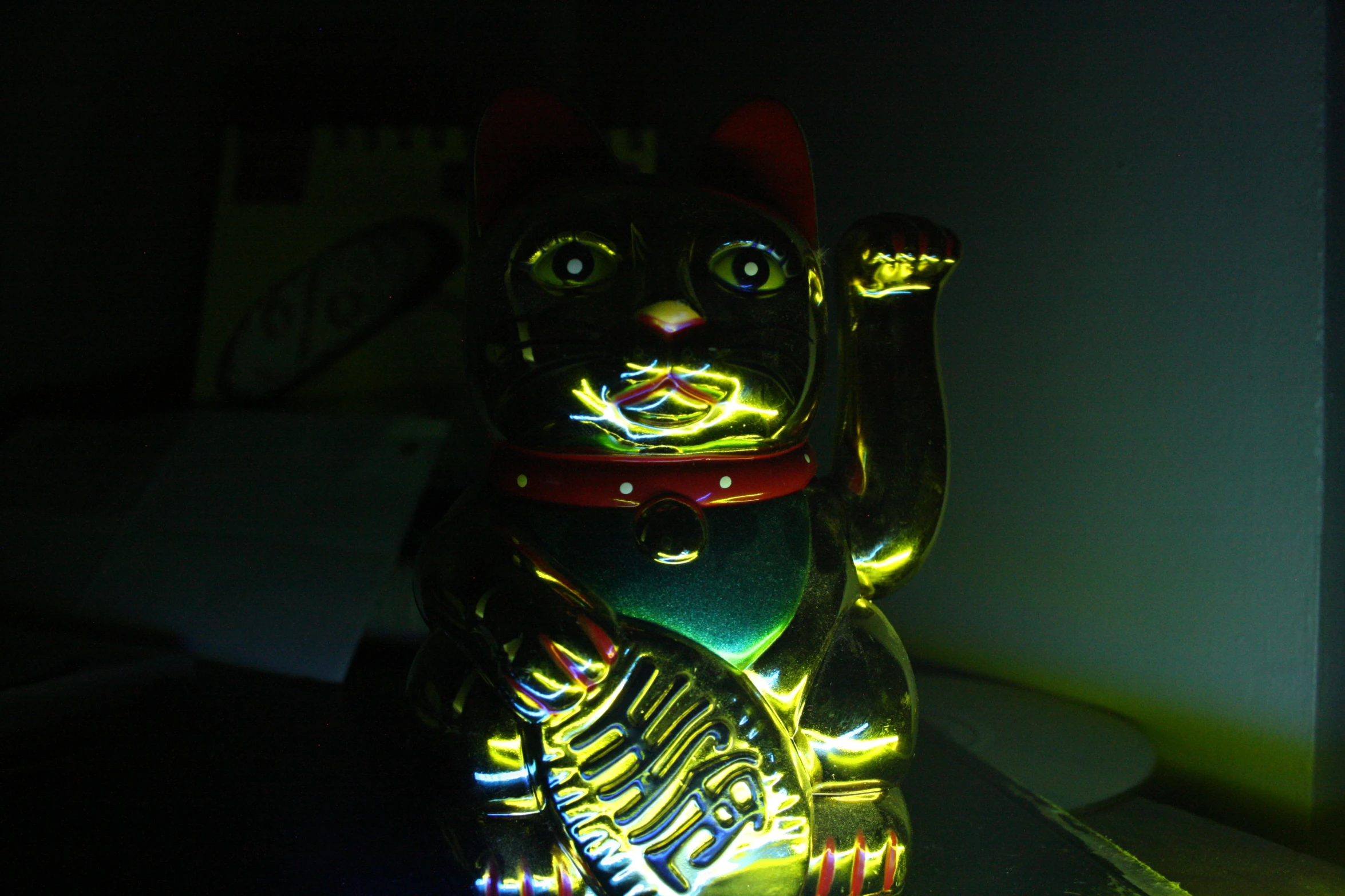 a cat shaped glass night light in a room