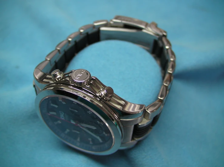 a watch with an attached chain on top of it