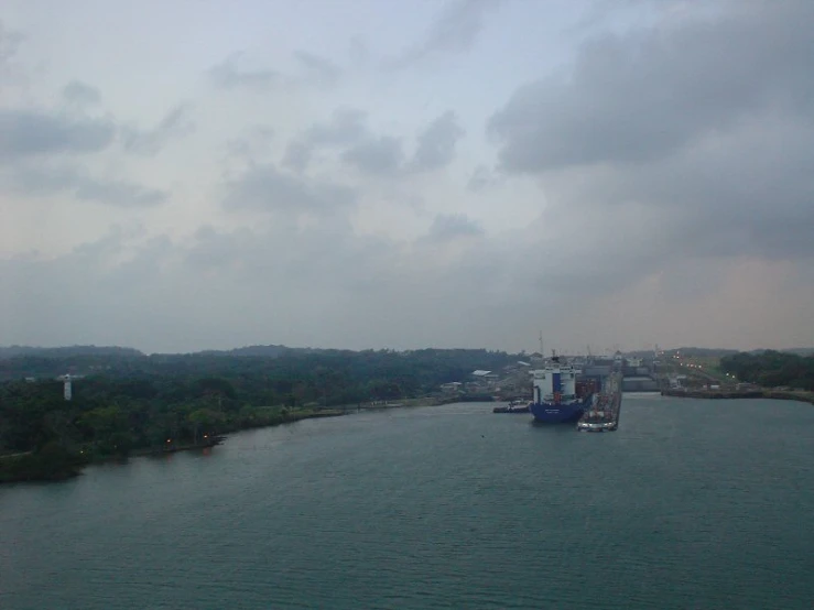 a large cruise ship is traveling down a river