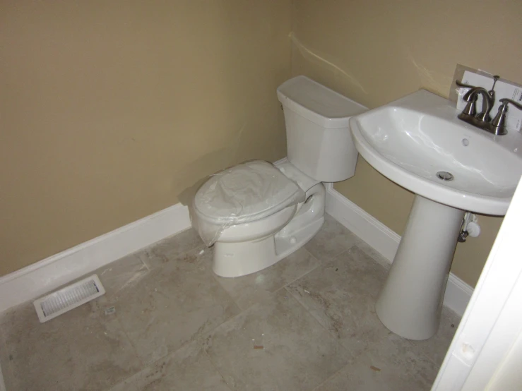 a small bathroom that has a sink and toilet in it