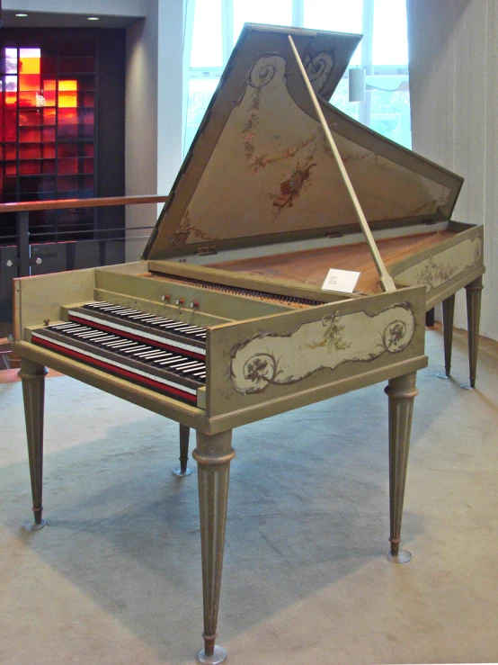 an antique piano sitting in the center of a room