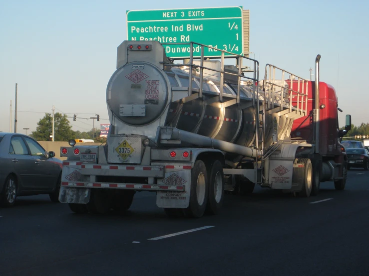 a semi truck is stopped at a traffic light