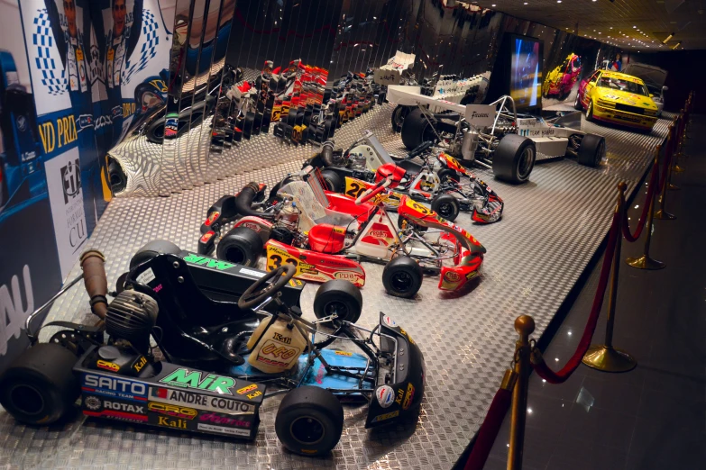 toy racing cars lined up and parked on display