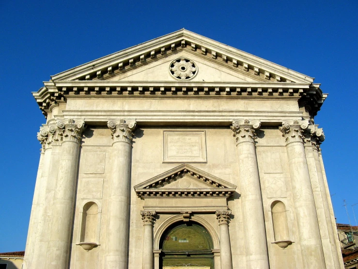 the clock is mounted on the side of this historical building