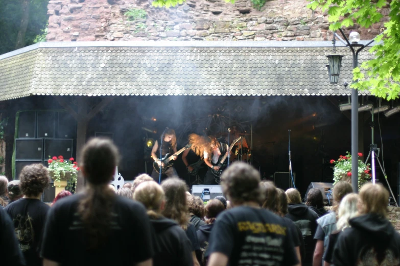 a group of people watching music on stage