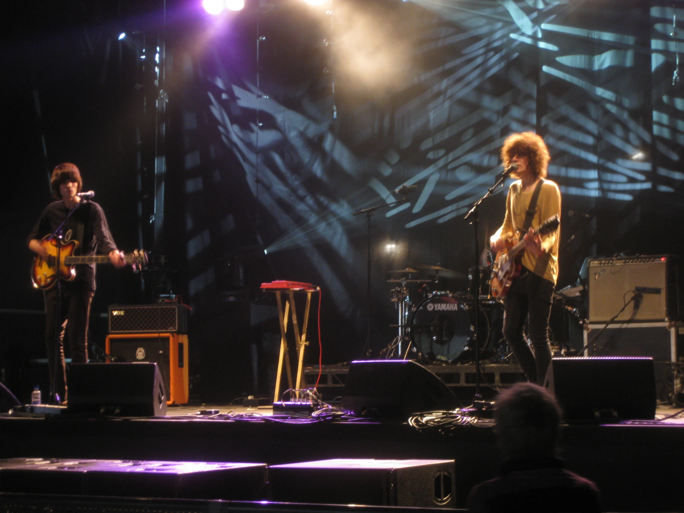 a group of people singing on a stage