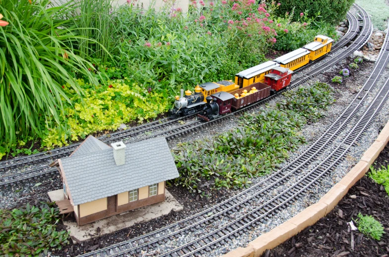 an overhead view of a miniature train track, showing the track and train cars