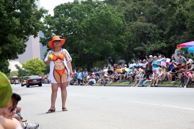 a group of people gathered at the street to watch a parade