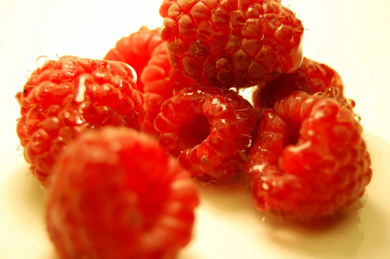 a group of raspberries are on the table