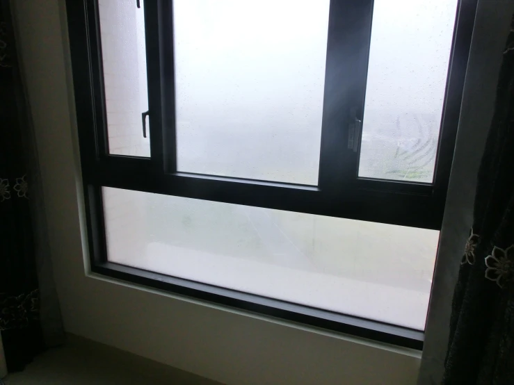 a white window that has water coming out of it