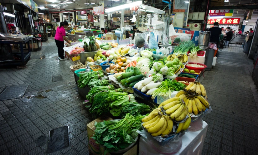 a large display of fruits and vegetables at a market