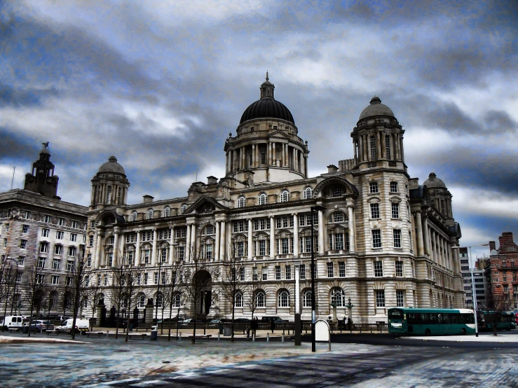 large building with a large dome and two towers, surrounded by street lights