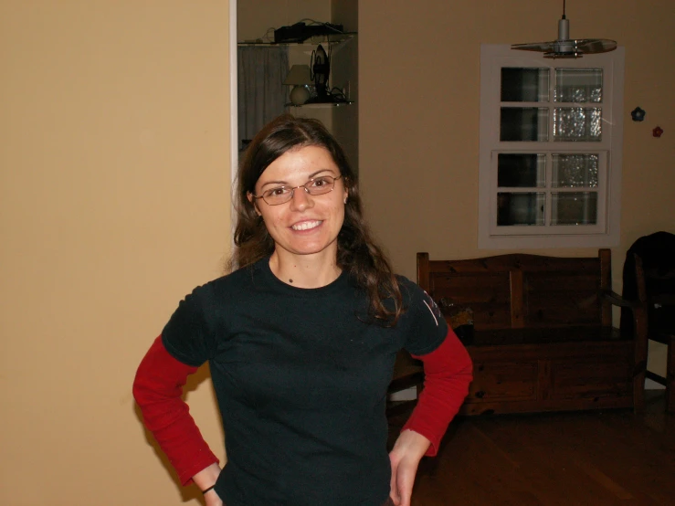 an attractive lady standing in the living room