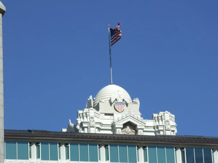 a flag and dome top on top of a building