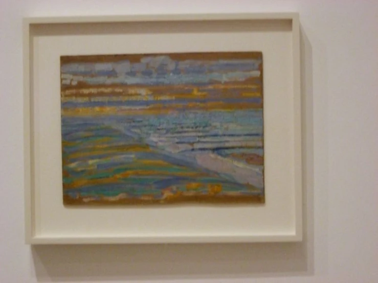 a small white painting with the top of the frame off