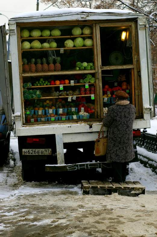 a large truck with a small produce cart