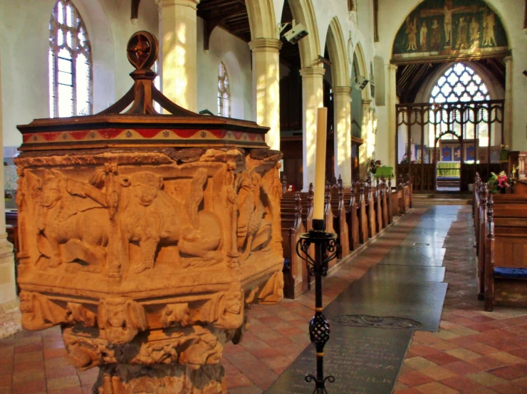 a church with a very ornate alter and ornate stone