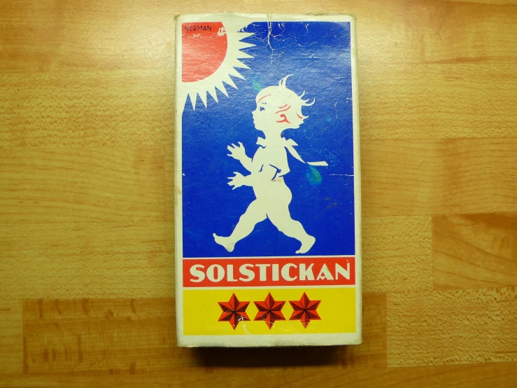 an old matchestick of a small child with a picture on it