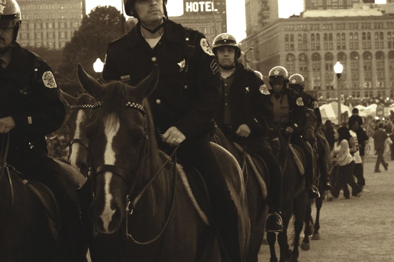the cops are riding their horses in a parade